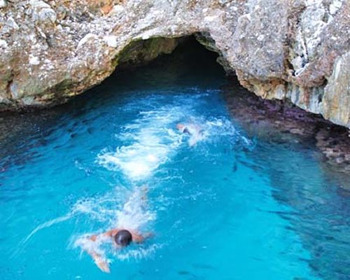View of people swimming at the grotto pool.