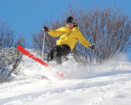 A man skiing in the snow.