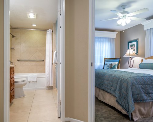 Bedroom with king bed and attached bathroom.