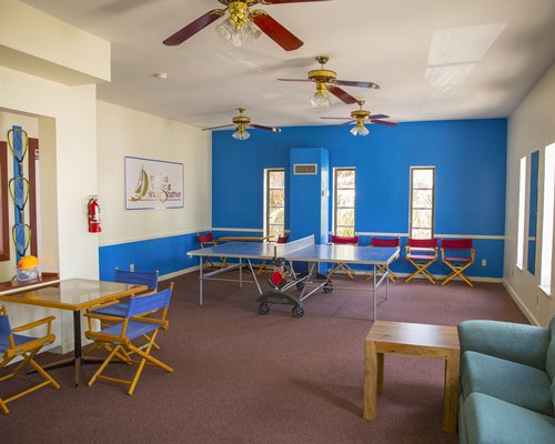 An indoor recreational area with ping pong table.
