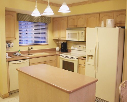 A well equipped kitchen and breakfast bar.