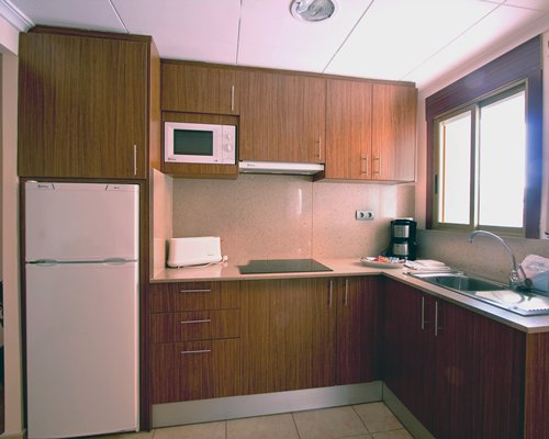 A well equipped kitchen with a sink.