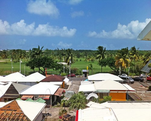 An aerial view of units at Green Blue Houses with parking lot.