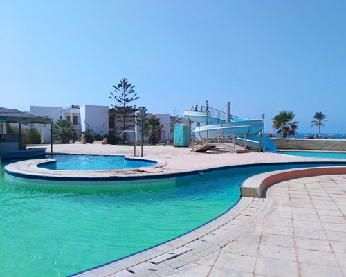 A view of pool and waterslide.