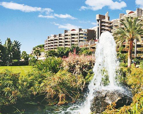 Scenic view of a water fountain alongside the resort.