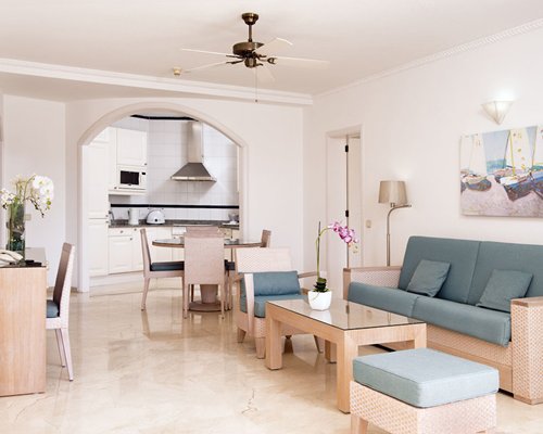 An open plan living room and a dining table.