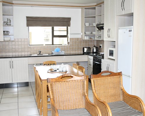 An open plan dining and kitchen area with a microwave oven.