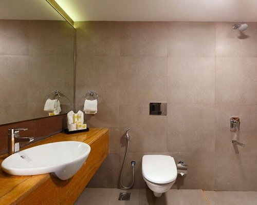 A bathroom with shower and sink.