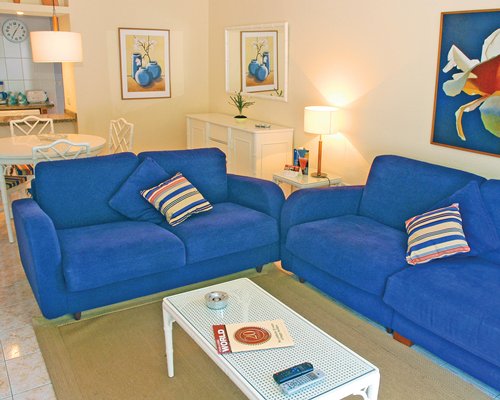 A well furnished living room and dining area.