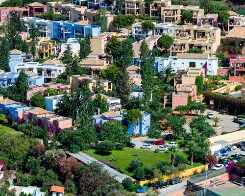 An aerial view of Candia Park Village with buildings and parking lot.