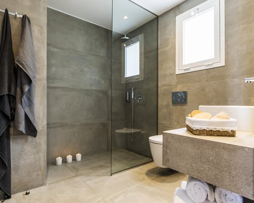 A bathroom with shower stall.