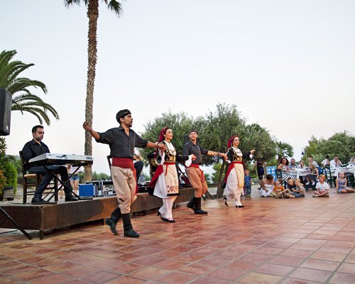 A set of people dancing with a music played in a background and entertaining others.