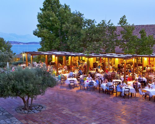 A large outdoor dining area at twilight.