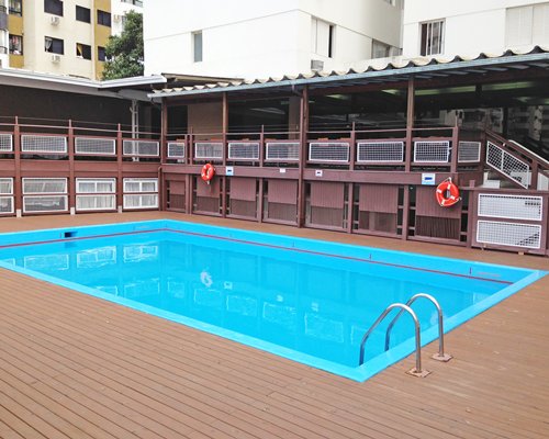 An outdoor swimming pool alongside the resort condos.