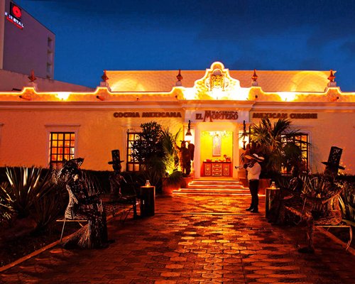 Pathway leading to Krystal International Vacation Club Cancun at dusk.