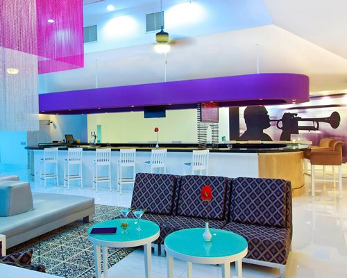 A well furnished bar alongside lounge area.