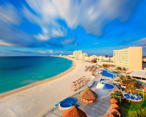 An aerial view of Krystal International Vacation Club Cancun resort alongside the ocean.