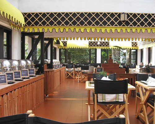 An indoor buffet with multiple dining tables.