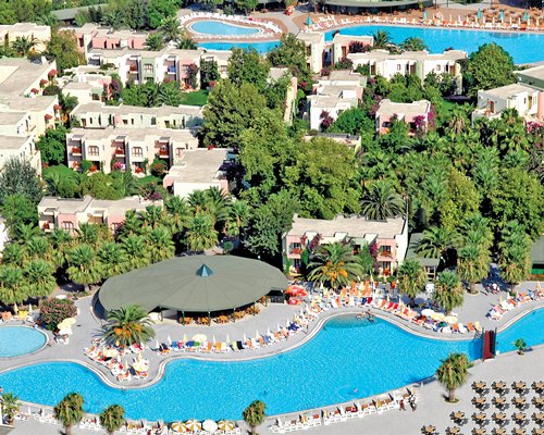 An aerial view of the Golden Beach resort with outdoor swimming pool and chaise lounge chair.