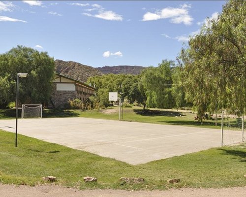 Scenic outdoor recreation area with basket and football court.