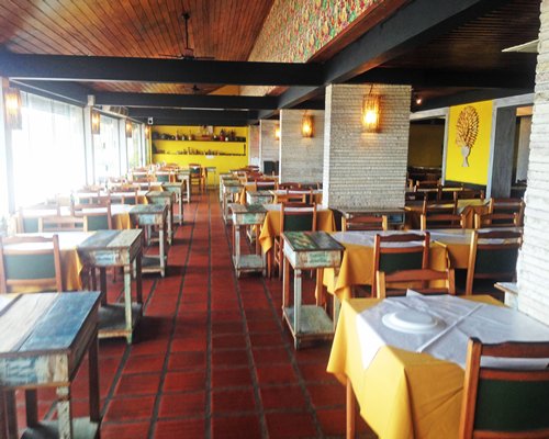 An indoor fine dining restaurant with an outside view.