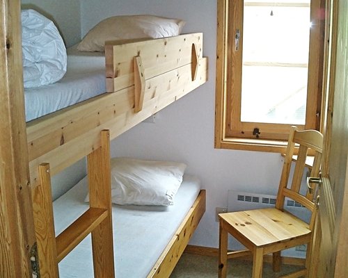 A well furnished bedroom with two bunk beds.