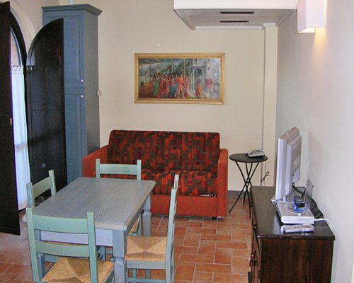 An open plan living and dining area with a television.