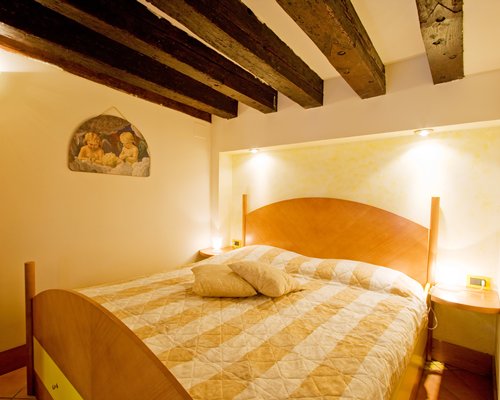 A furnished bedroom with a double bed.