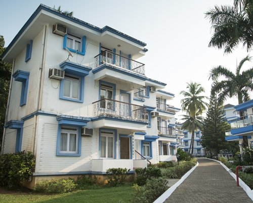 Scenic ground view of the Karma Royal Palms resort with a pathway.