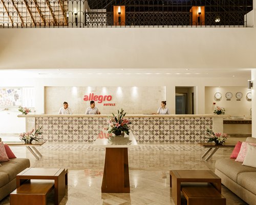 A large furnished lobby with reception desk.