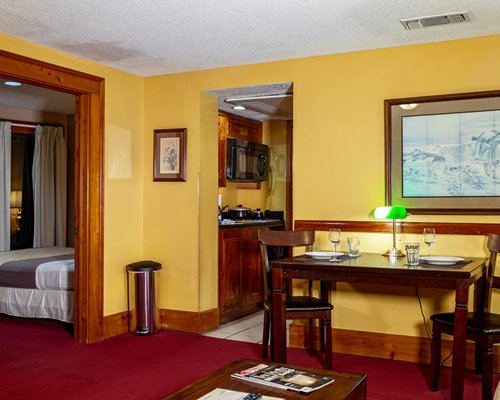 A well furnished bedroom with a queen bed.