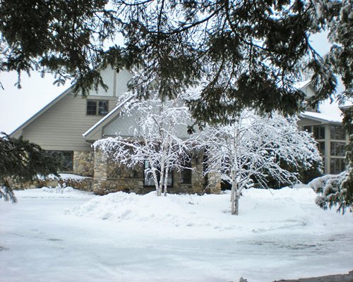 A view of the Glidden Lodge Beach Resort covered in snow.
