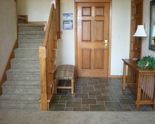 Interior view of Glidden Lodge Beach Resort with a stairway.