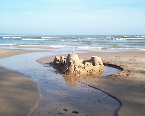 A sand castle at the beach.