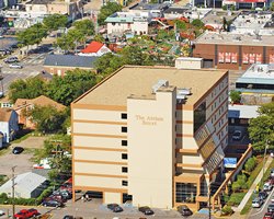 An aerial view of Atrium Resort alongside the parking lot.
