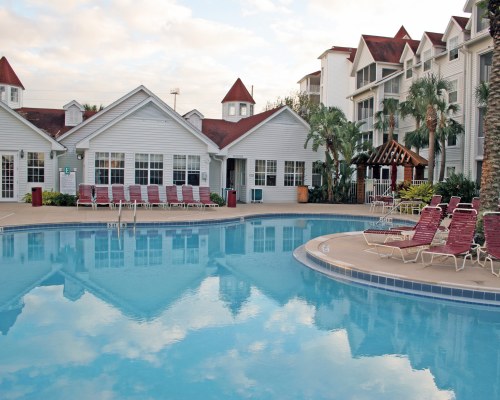 Outdoor swimming pool with chaise lounge chairs.