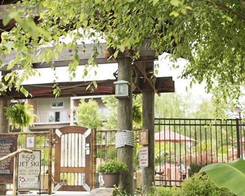 A scenic exterior view of resort unit with trees.