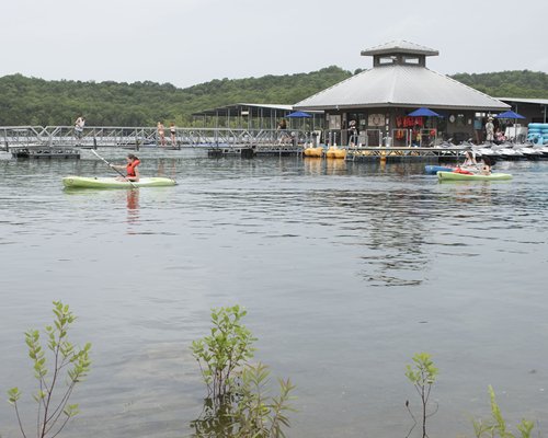 A view of the pier with kayaking and paddle boats.