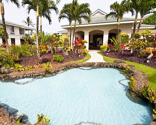 An outdoor pool alongside resort condos.