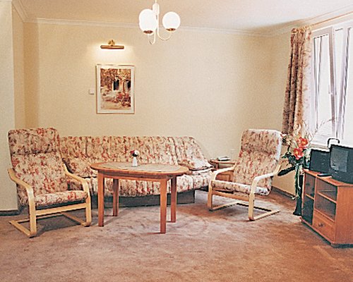 A well furnished living room with a television.