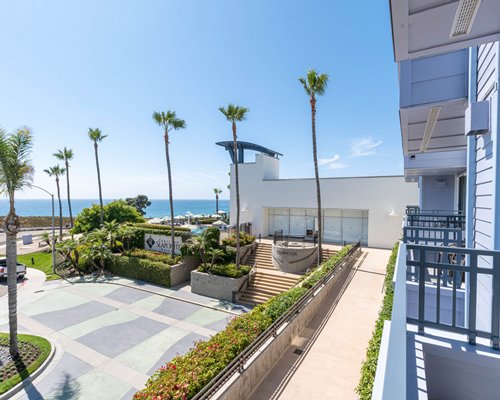 An exterior view of the Carlsbad Seapointe Resort at night.