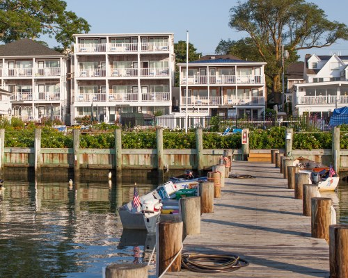 EXTERIOR VIEW OF THE HARBORSIDE INN FROM A PIER.
