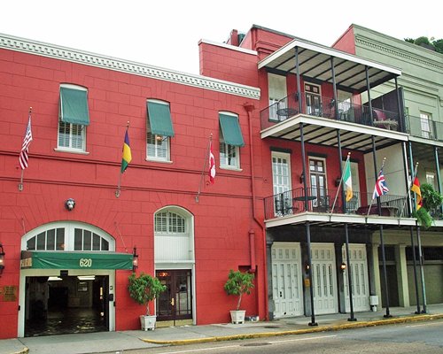 Exterior view of Plaza Suite Hotel Resort with national flags.