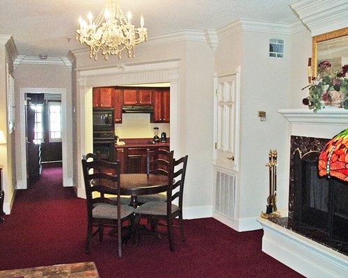 A well furnished living room with dining area and open plan kitchen.