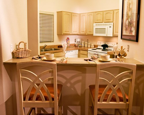 A well furnished kitchen with a breakfast bar.