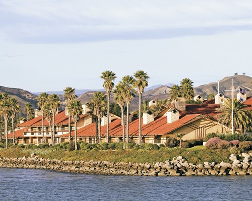 Exterior view of Harbortown Point Marina Resort & Club alongside waterfront.