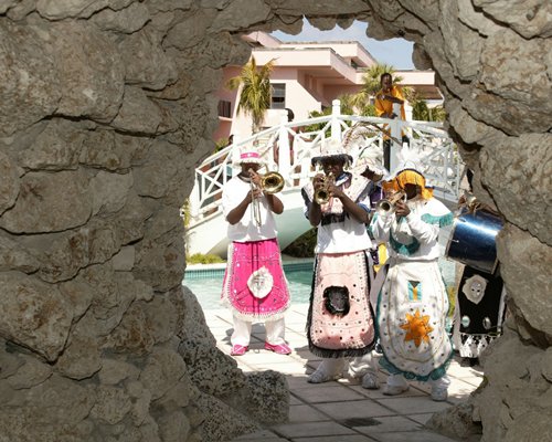 Set of people playing an instrument in the resort.