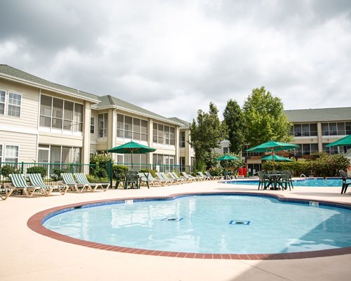 An indoor swimming pool with a patio.