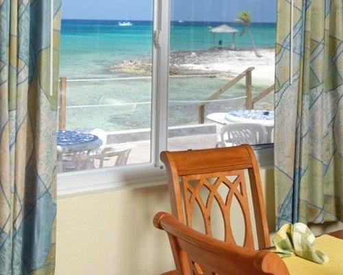 A well furnished dining alongside with a view of the ocean.