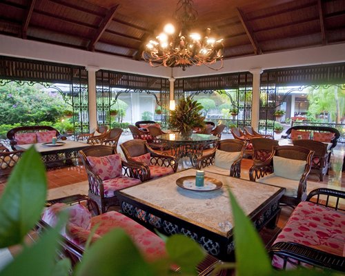 A well furnished lounge area with an outside view.